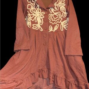 Fun asymmetrical tunic/dress with 3/4 sleeves and ruffled hem,pockets,rust color